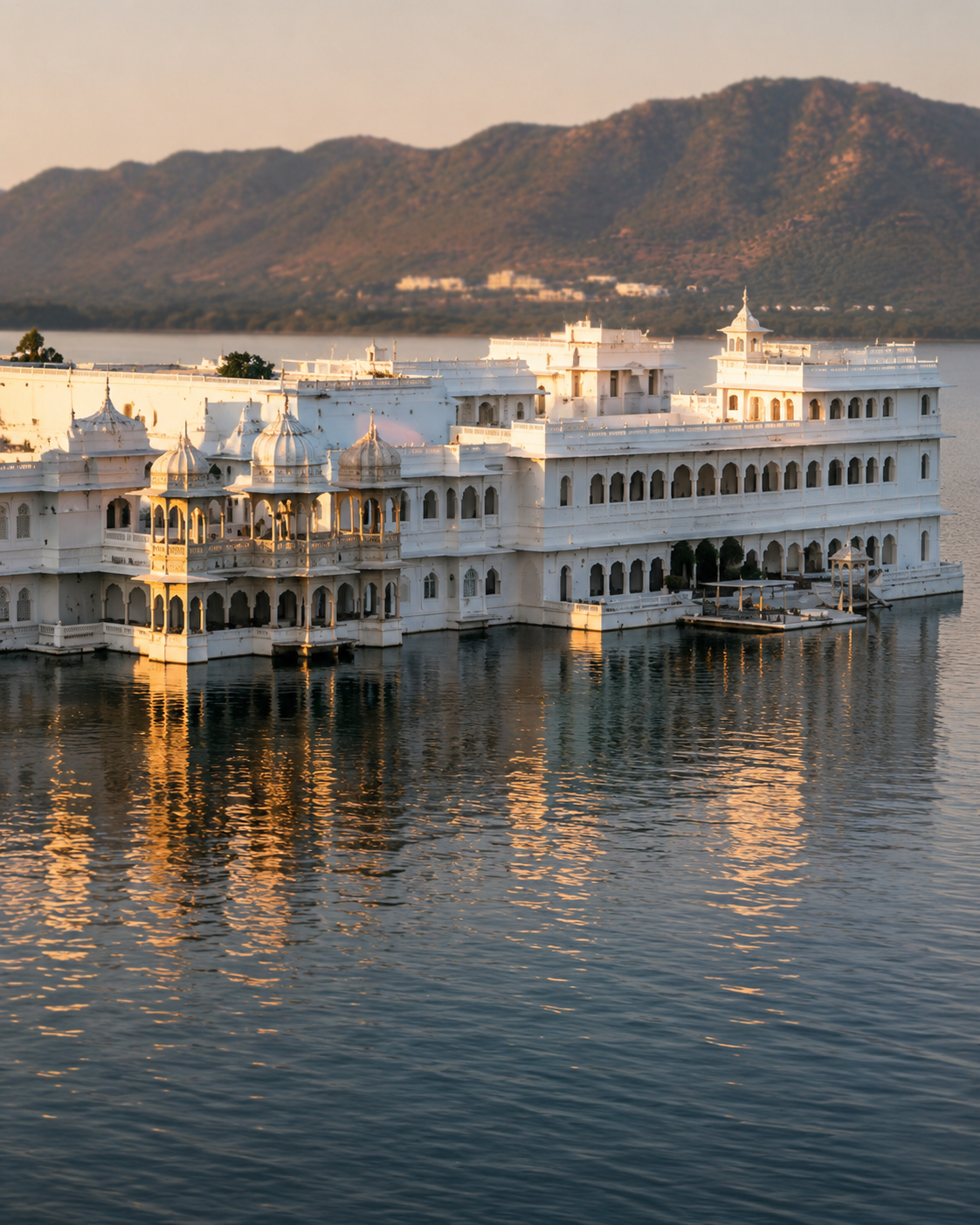 Lake Palace at golden hour reflected in Lake Pichola, Udaipur